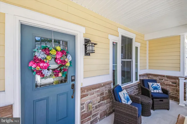 a view of a swimming pool with a patio and a garden