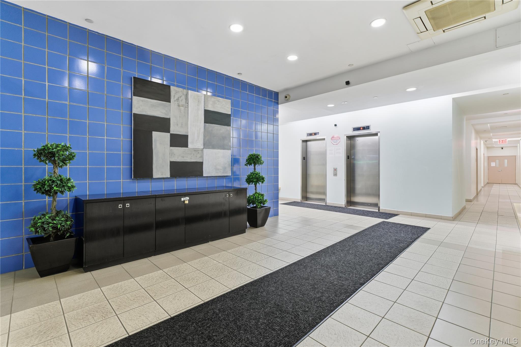 3044 3rd Avenue, Unit 9C Bronx, NY 10451 - Photo 3 of 15 Building lobby with recessed lighting and tile walls