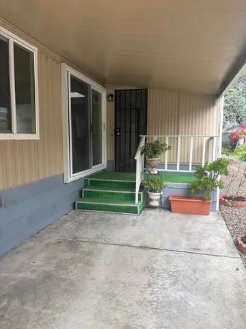 a view of a garden with sitting area