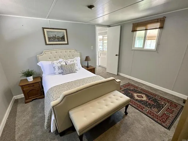 a kitchen with a sink a stove a refrigerator and cabinets