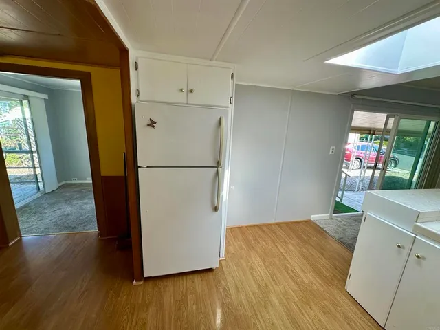 a view of entryway and hallway with a front door