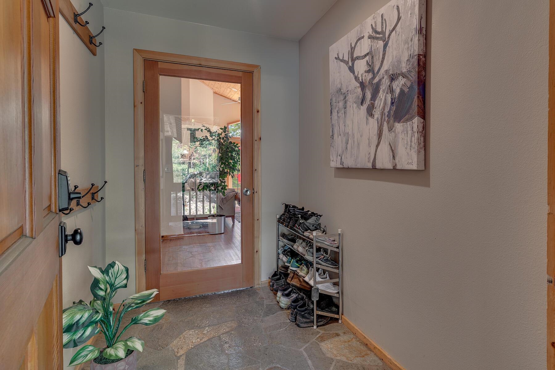 11511 Baden Road Truckee, CA 96161 - Photo 4 of 28 an entryway with table and a potted plant