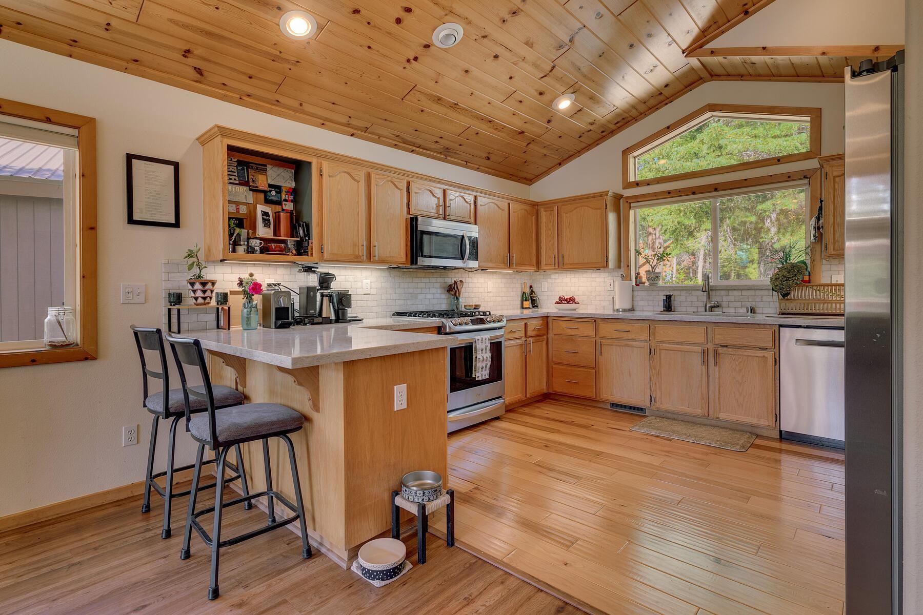11511 Baden Road Truckee, CA 96161 - Photo 5 of 28 a kitchen with a table chairs sink and cabinets