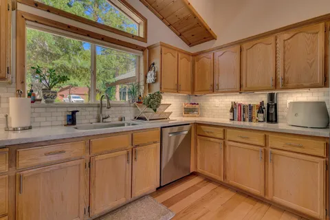 a kitchen with sink cabinets and window