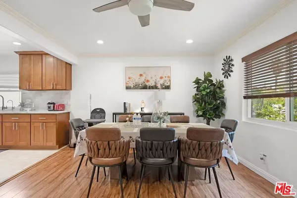 a view of a dining room with furniture and window