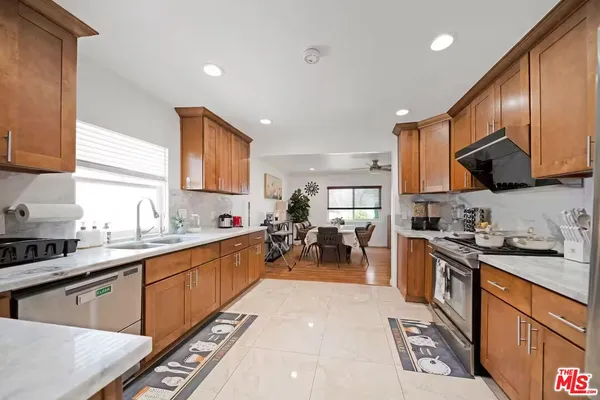 a kitchen with lots of counter top space a sink and cabinets