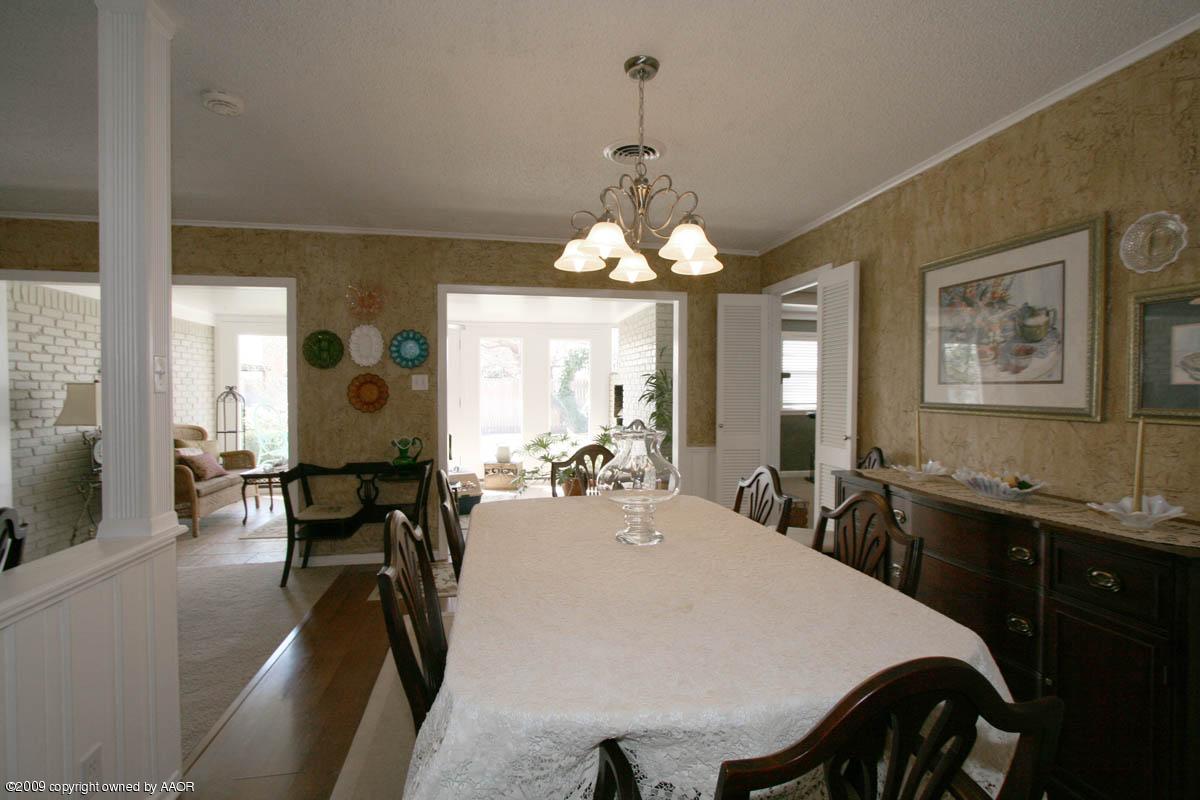 6015 Elmhurst Road Amarillo, TX 79106 - Photo 7 of 15 a view of a dining room with furniture and a large window