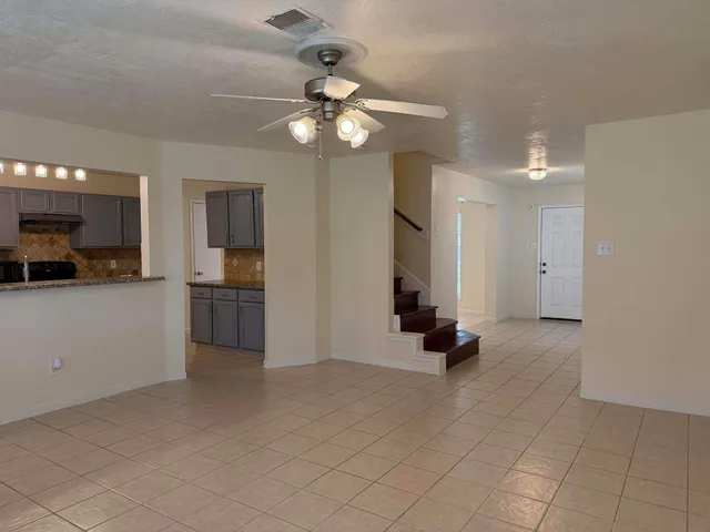 a view of kitchen with furniture and a window