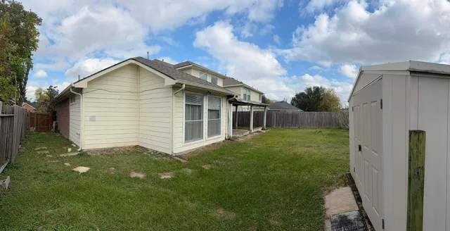 a backyard of a house with lots of green space