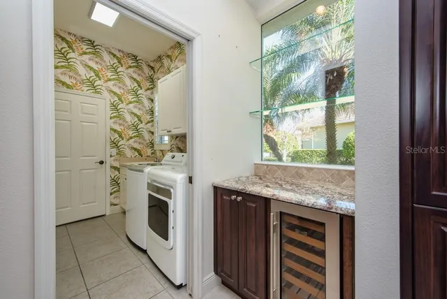a view of room with wooden floor and cabinets