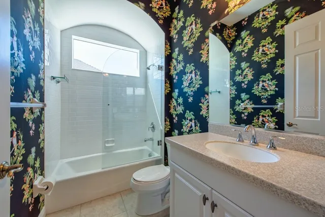 a view of a porch with furniture and a yard