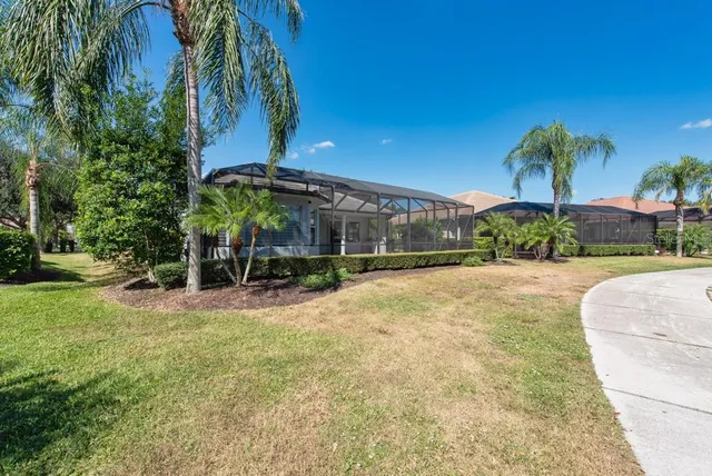 an aerial view of residential houses with outdoor space and river