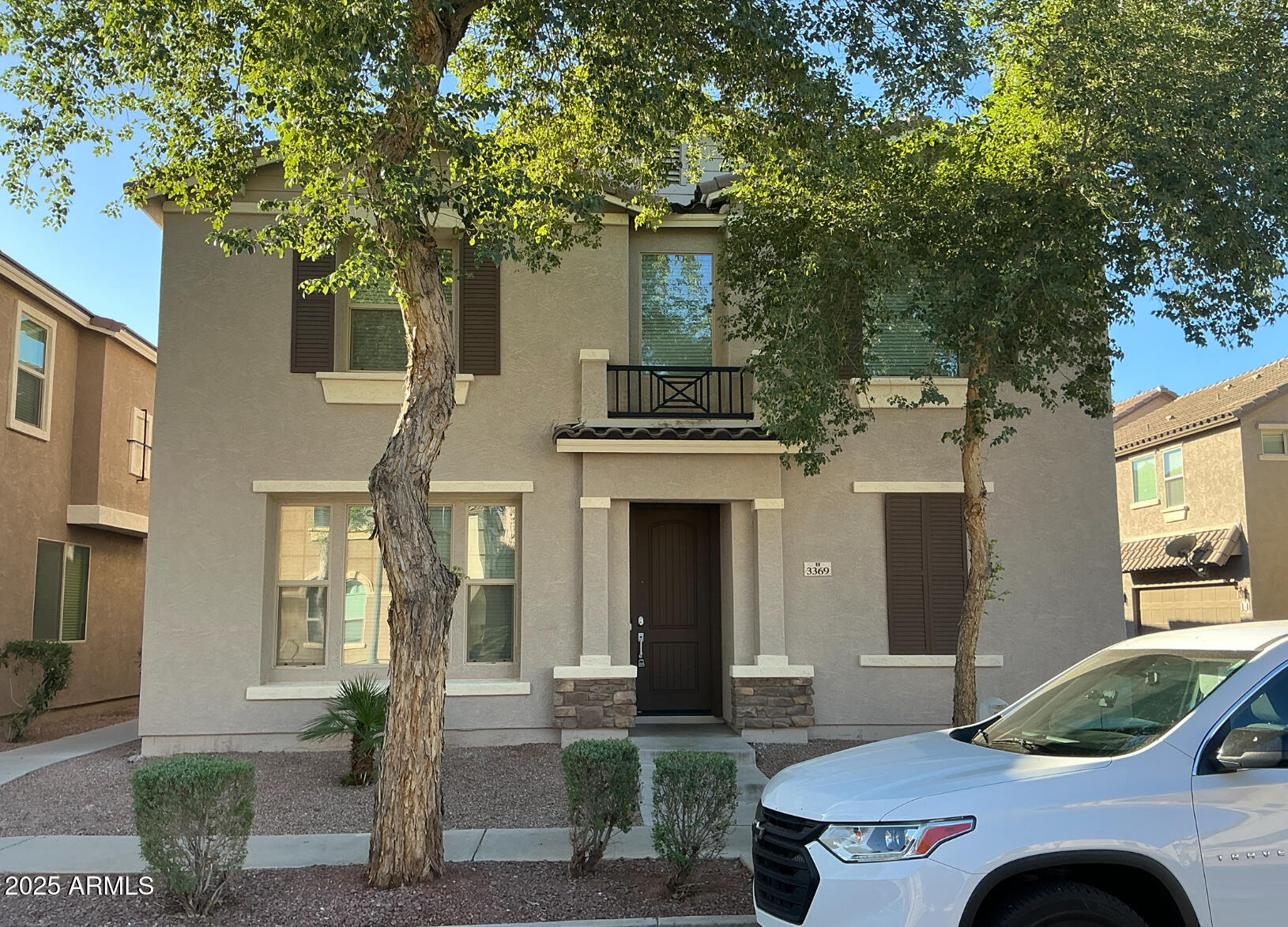 3369 East Constitution Drive Gilbert, AZ 85296 - Photo 1 of 6 a front view of a house with garden
