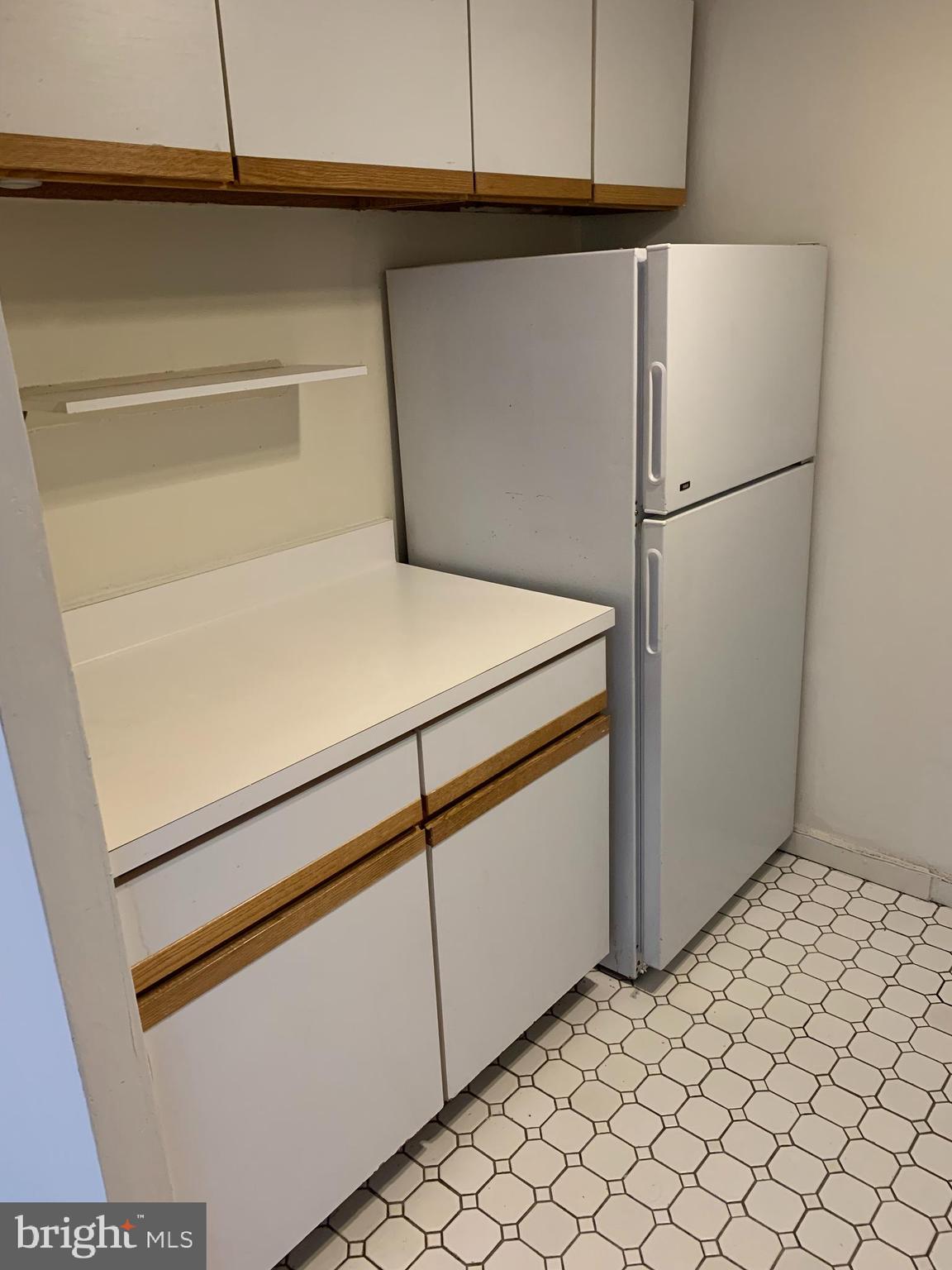 224-30 West Rittenhouse Square, Unit 2004 Philadelphia, PA 19103 - Photo 3 of 18 a white refrigerator freezer and a dishwasher in a kitchen