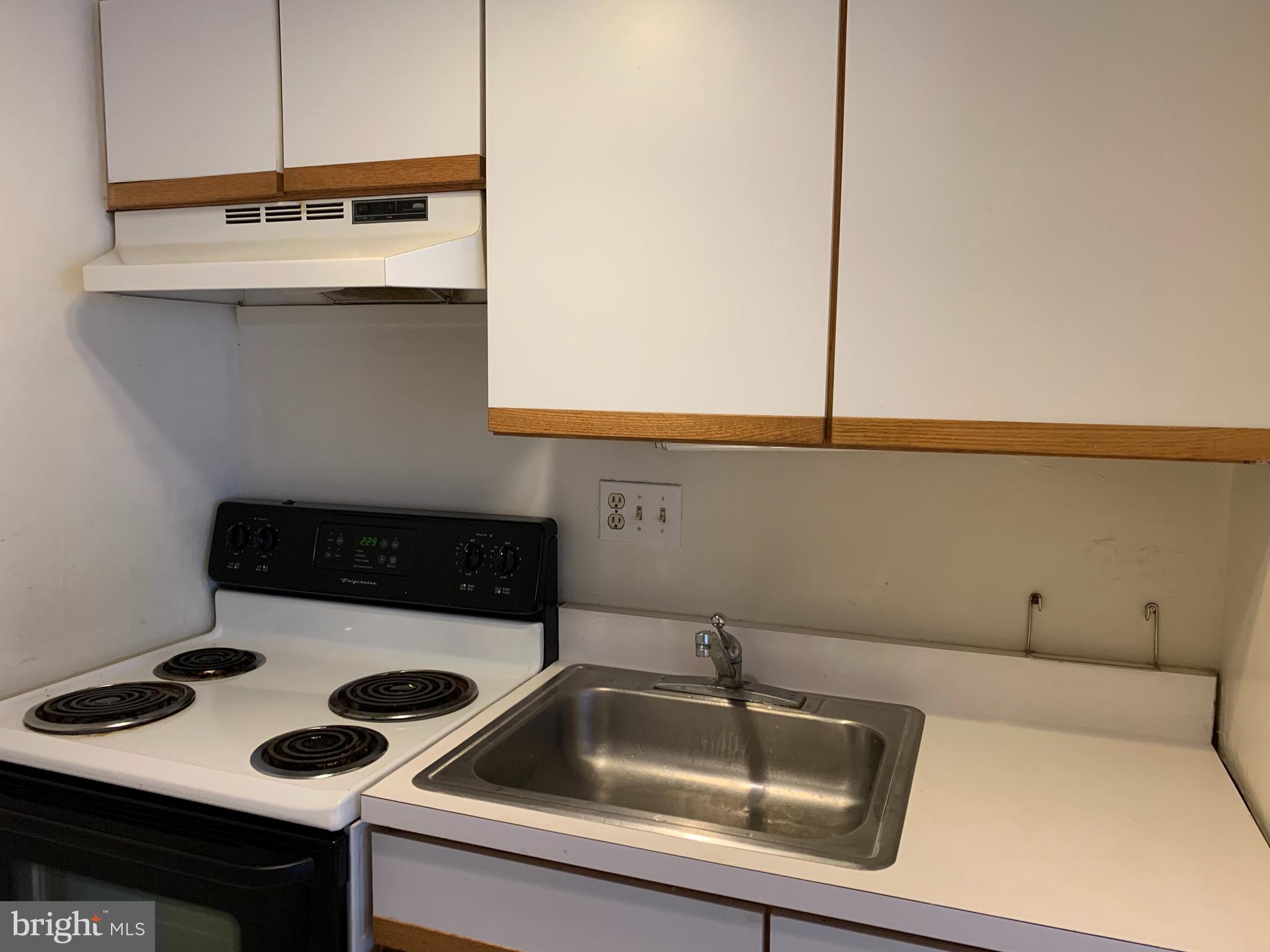 224-30 West Rittenhouse Square, Unit 2004 Philadelphia, PA 19103 - Photo 4 of 18 a kitchen with a sink and cabinets