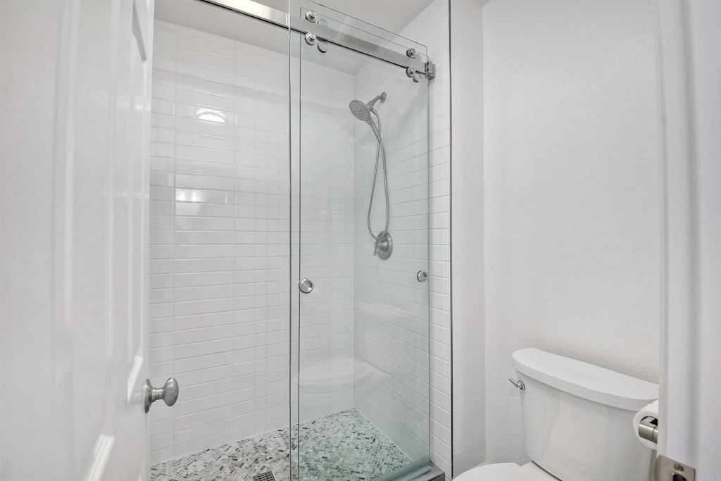735 Santa Paula Solana Beach, CA 92075 - Photo 19 of 61 a bathroom with a shower and toilet