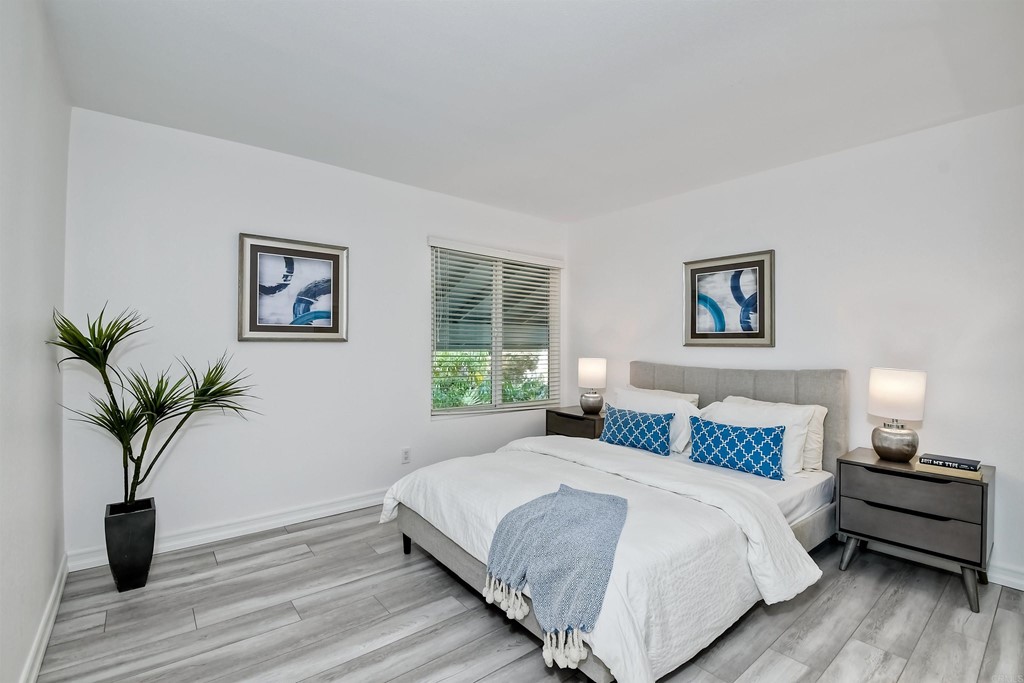 735 Santa Paula Solana Beach, CA 92075 - Photo 28 of 61 a bedroom with a large bed and a potted plant