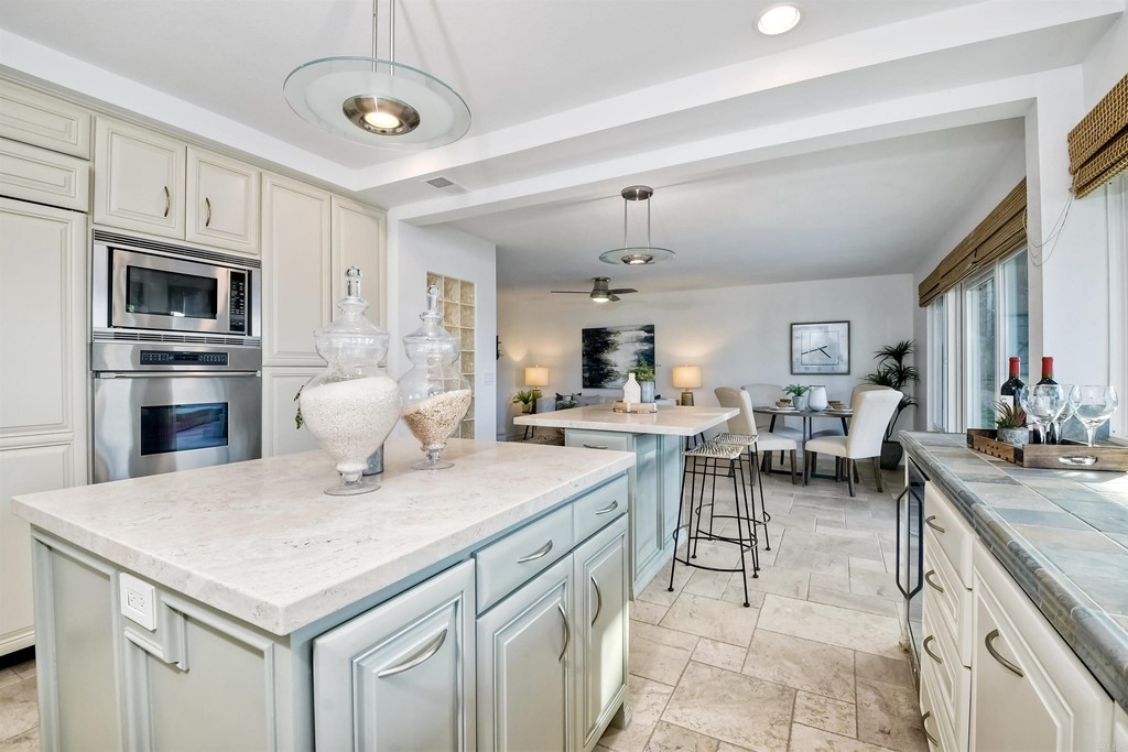 735 Santa Paula Solana Beach, CA 92075 - Photo 37 of 61 a open kitchen with stainless steel appliances granite countertop a stove refrigerator and a sink