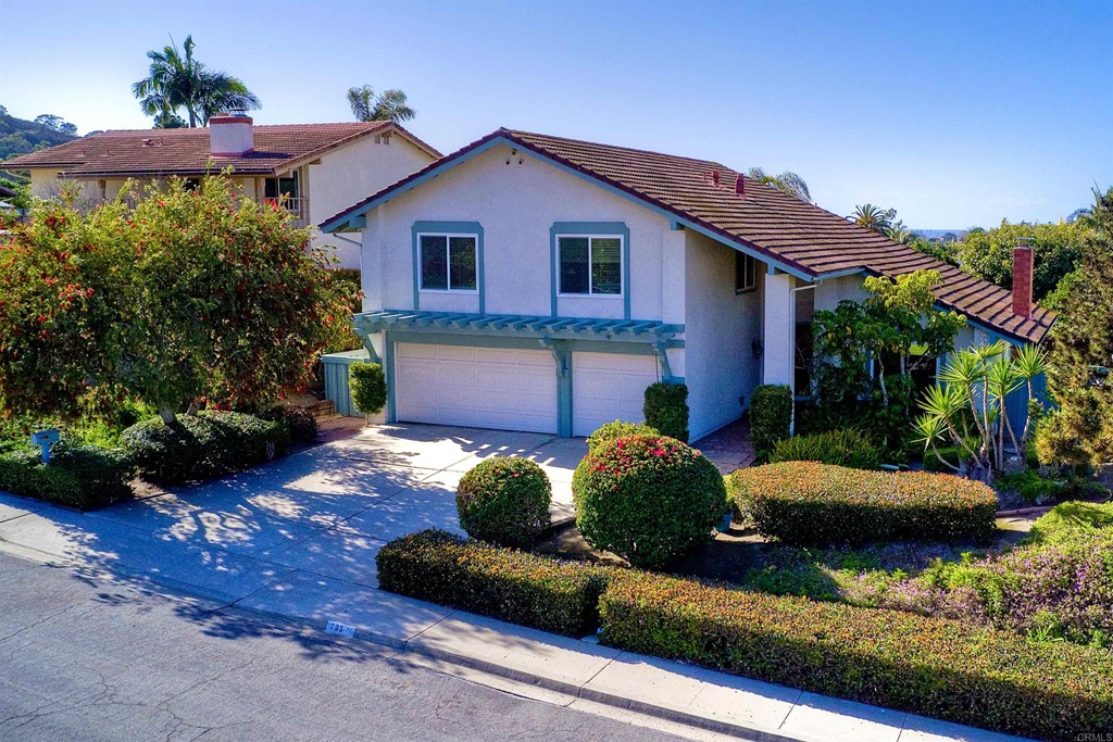 735 Santa Paula Solana Beach, CA 92075 - Photo 54 of 61 a front view of a house with a yard and potted plants