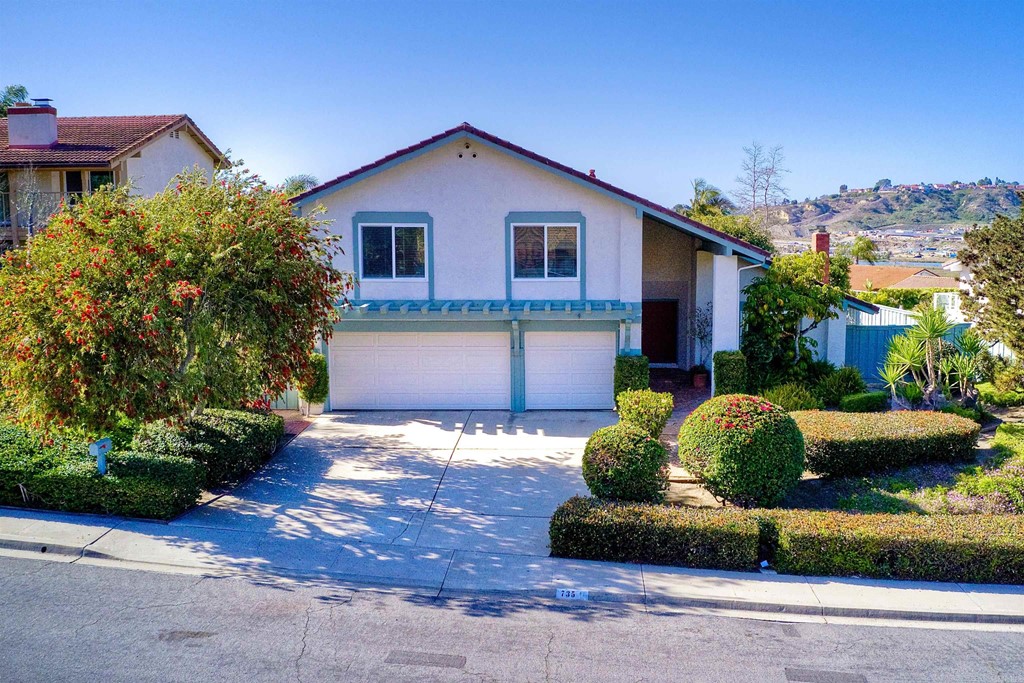 735 Santa Paula Solana Beach, CA 92075 - Photo 55 of 61 a front view of a house with a yard and garage