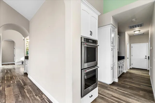 a kitchen with a sink and a refrigerator
