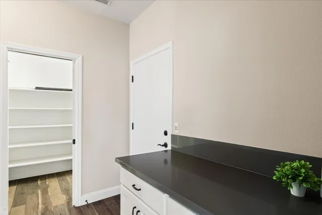 a view of an empty room with a window