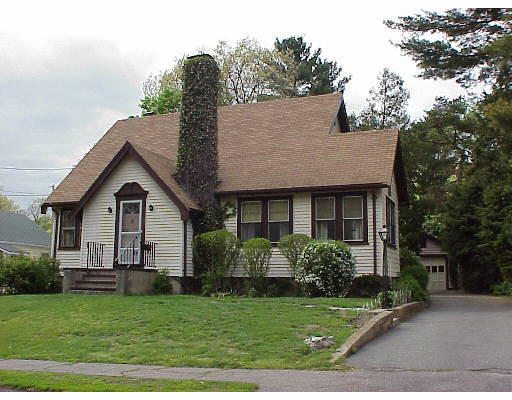 45 Grosvenor Road Needham, MA 02492 - Photo 1 of 1 a view of a yard in front of a house with plants and large tree