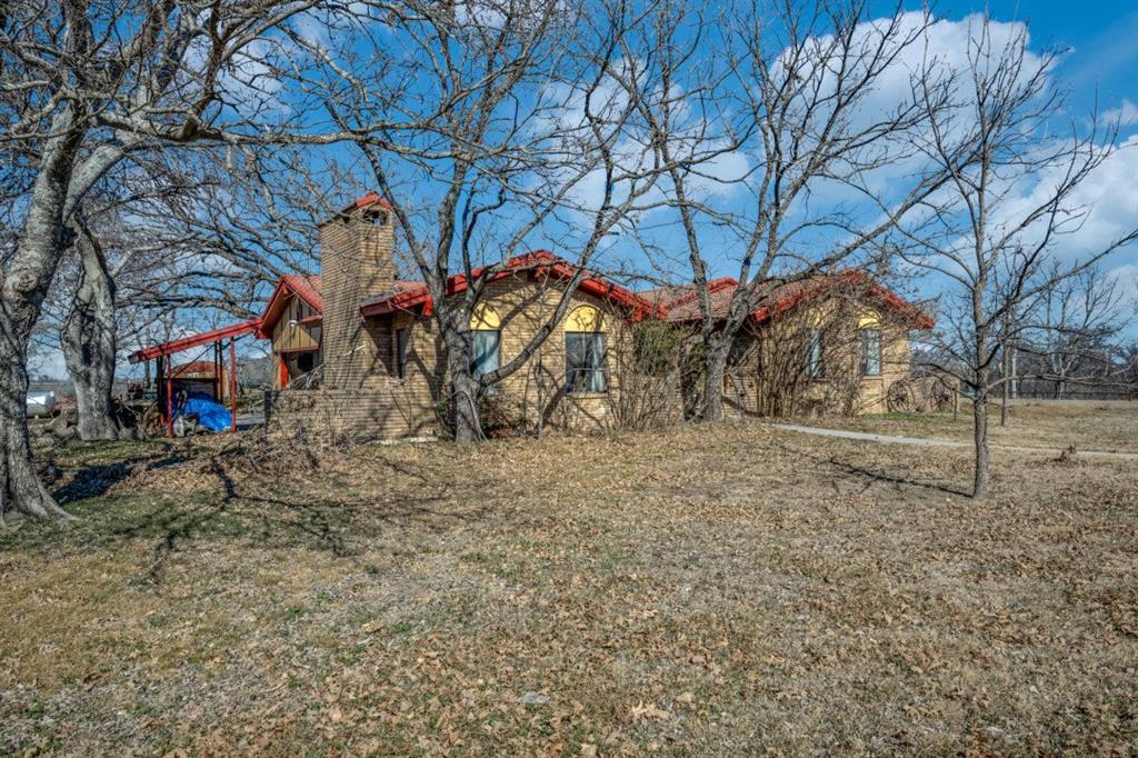 10367 Clear Creek Road West Sanger, TX 76266 - Photo 7 of 8 a view of a yard with a tree