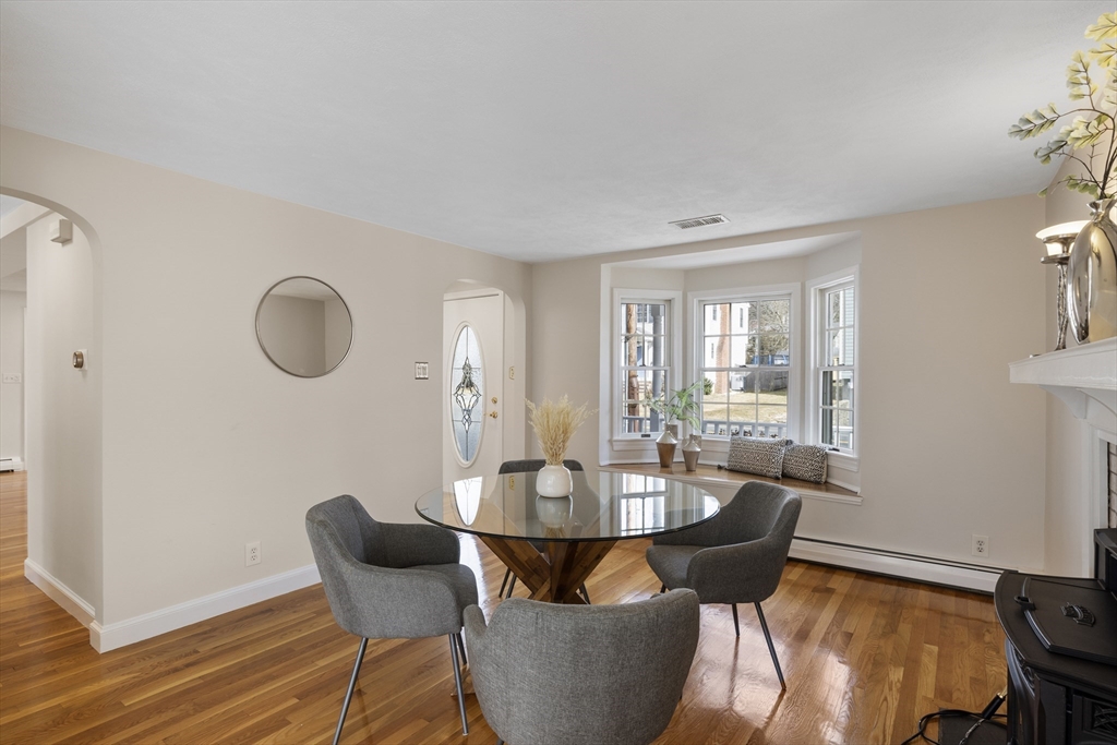 61 School Street Lexington, MA 02421 - Photo 14 of 42 a view of a dining room with furniture and wooden floor