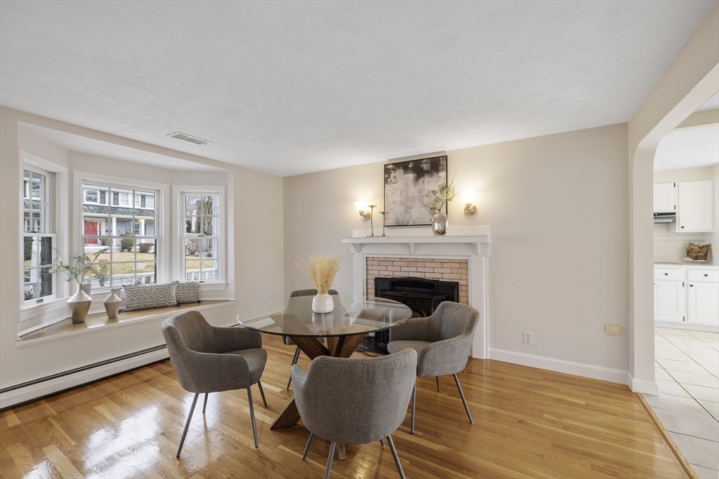 61 School Street Lexington, MA 02421 - Photo 17 of 42 a living room with furniture and a fireplace