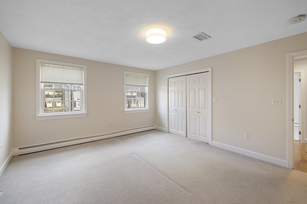 61 School Street Lexington, MA 02421 - Photo 26 of 42 a view of an empty room with a window