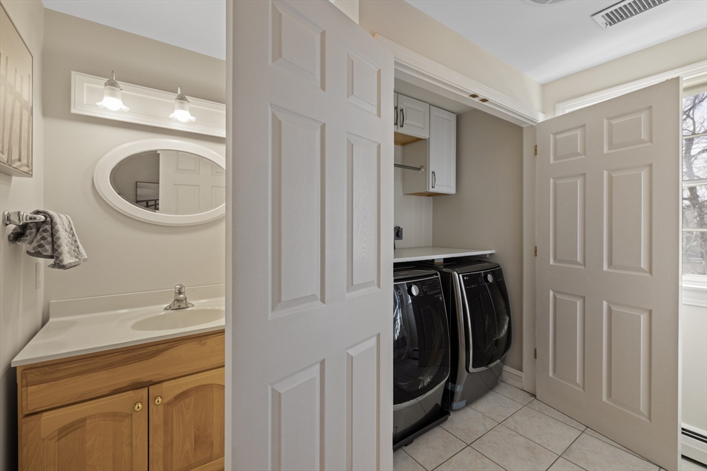 61 School Street Lexington, MA 02421 - Photo 28 of 42 a utility room with closet dryer and washer