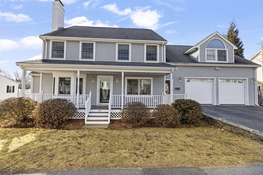 61 School Street Lexington, MA 02421 - Photo 3 of 42 a front view of a house with a yard