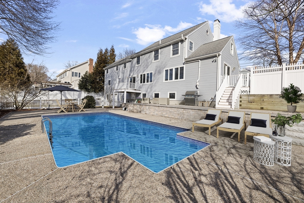 61 School Street Lexington, MA 02421 - Photo 40 of 42 a view of a building with backyard and sitting area