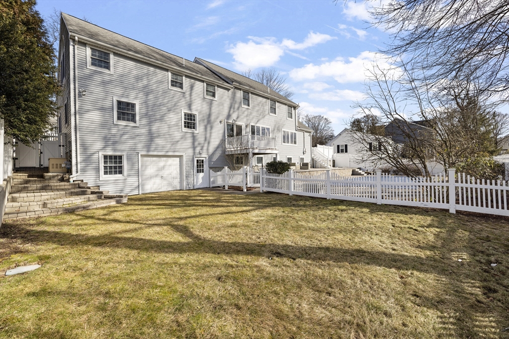 61 School Street Lexington, MA 02421 - Photo 41 of 42 a swimming pool with outdoor seating and yard