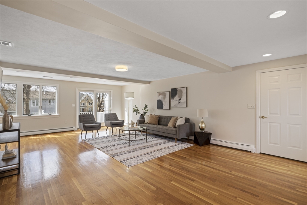 61 School Street Lexington, MA 02421 - Photo 8 of 42 a living room with furniture and a table