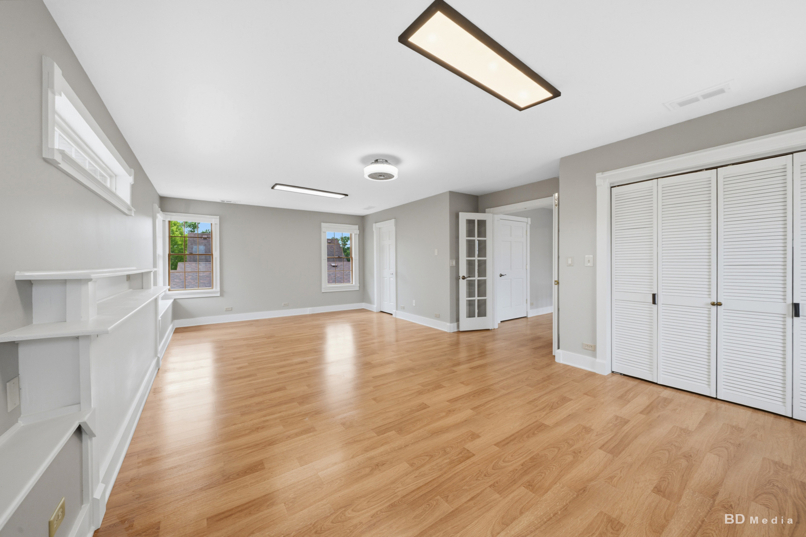 10428 South Springfield Avenue Chicago, IL 60655 - Photo 19 of 43 a view of an empty room with wooden floor and a window