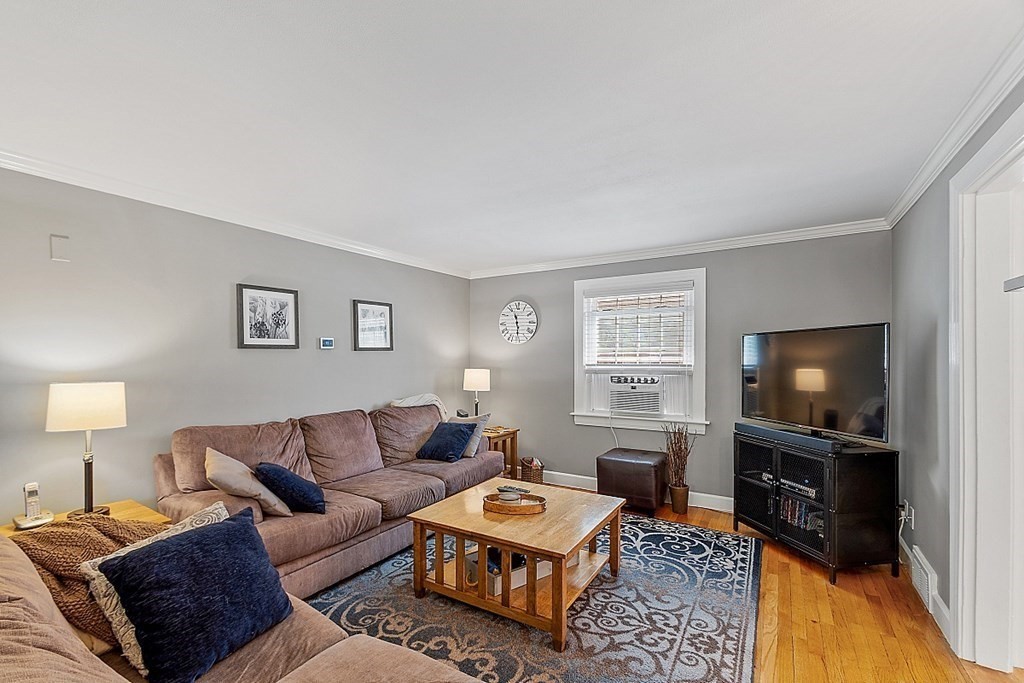 43 Sylvan Road Lancaster, MA 01523 - Photo 12 of 26 a living room with furniture and a flat screen tv