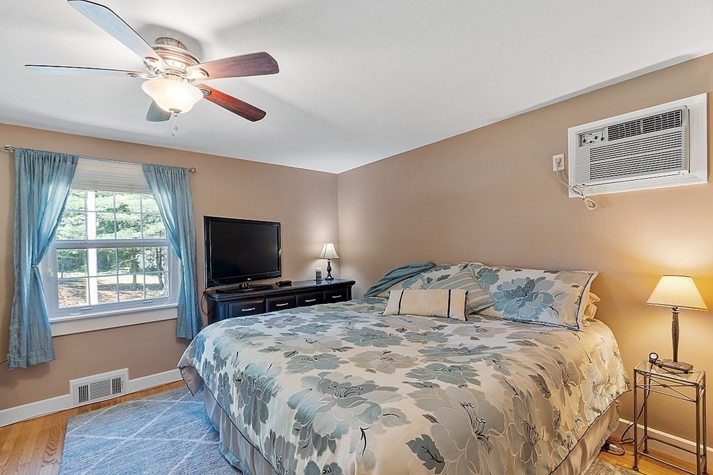 43 Sylvan Road Lancaster, MA 01523 - Photo 14 of 26 a bedroom with a bed and a flat screen tv