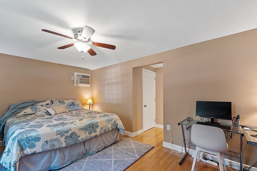 43 Sylvan Road Lancaster, MA 01523 - Photo 15 of 26 a bedroom with a bed and a table