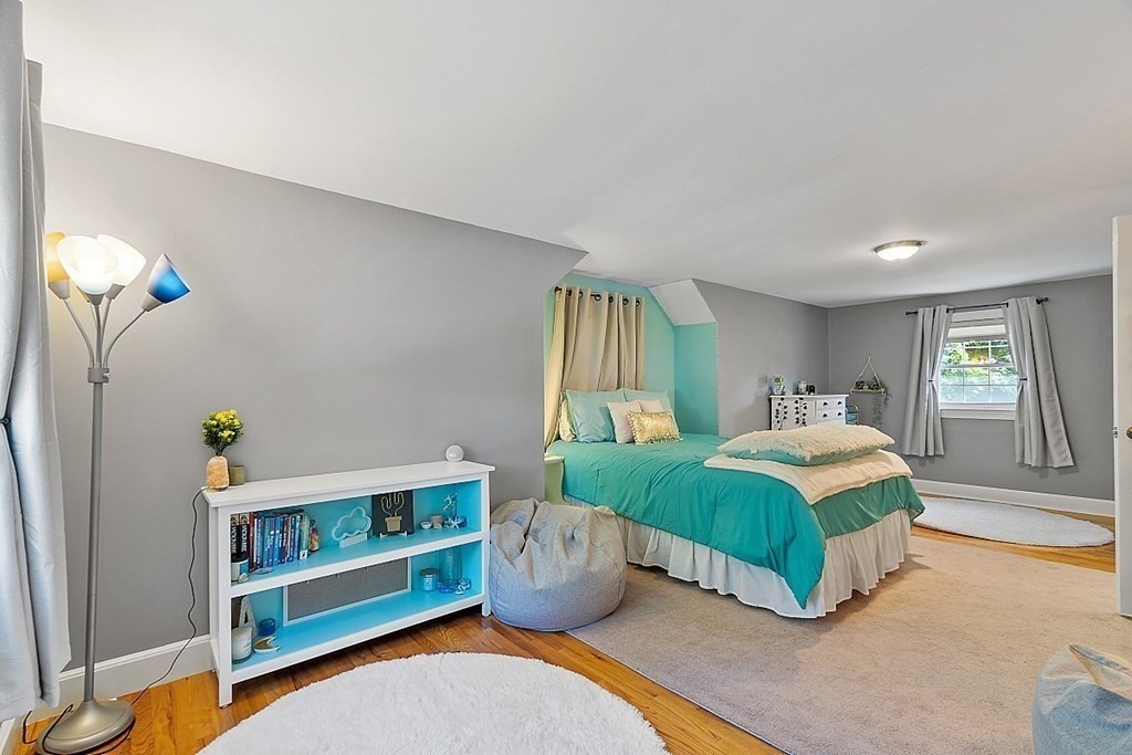 43 Sylvan Road Lancaster, MA 01523 - Photo 17 of 26 a bedroom with a bed and a window