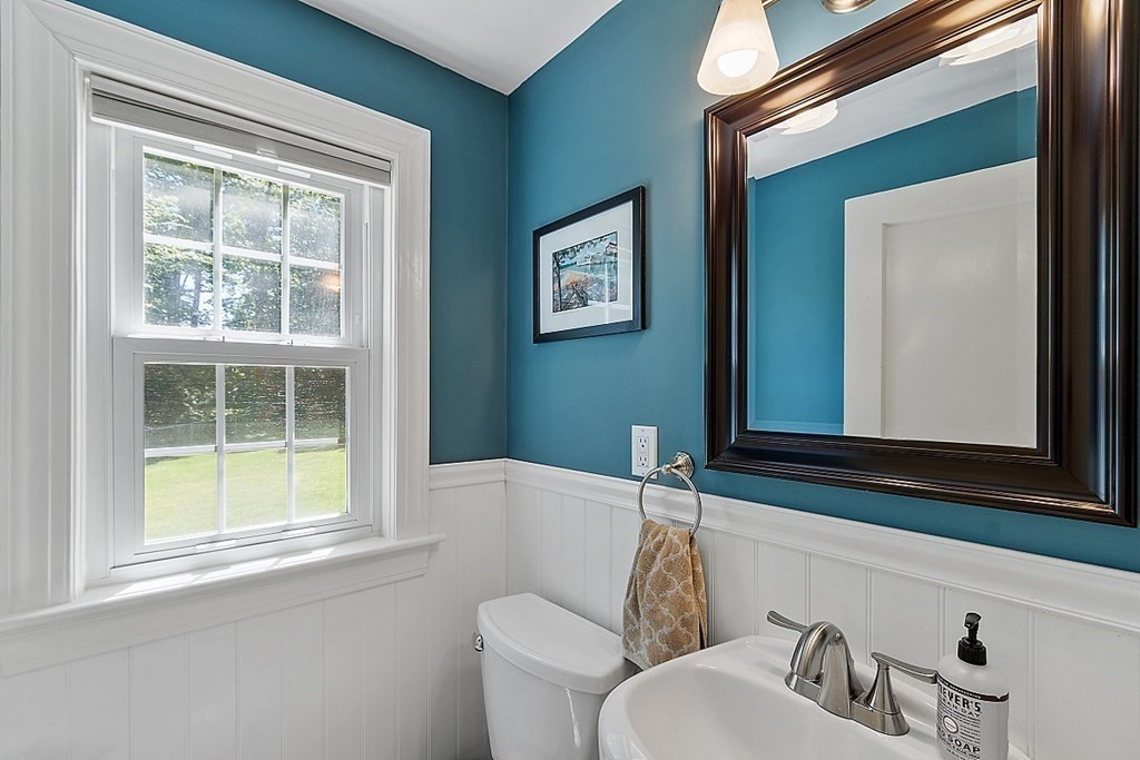 43 Sylvan Road Lancaster, MA 01523 - Photo 20 of 26 a bathroom with a toilet sink and mirror