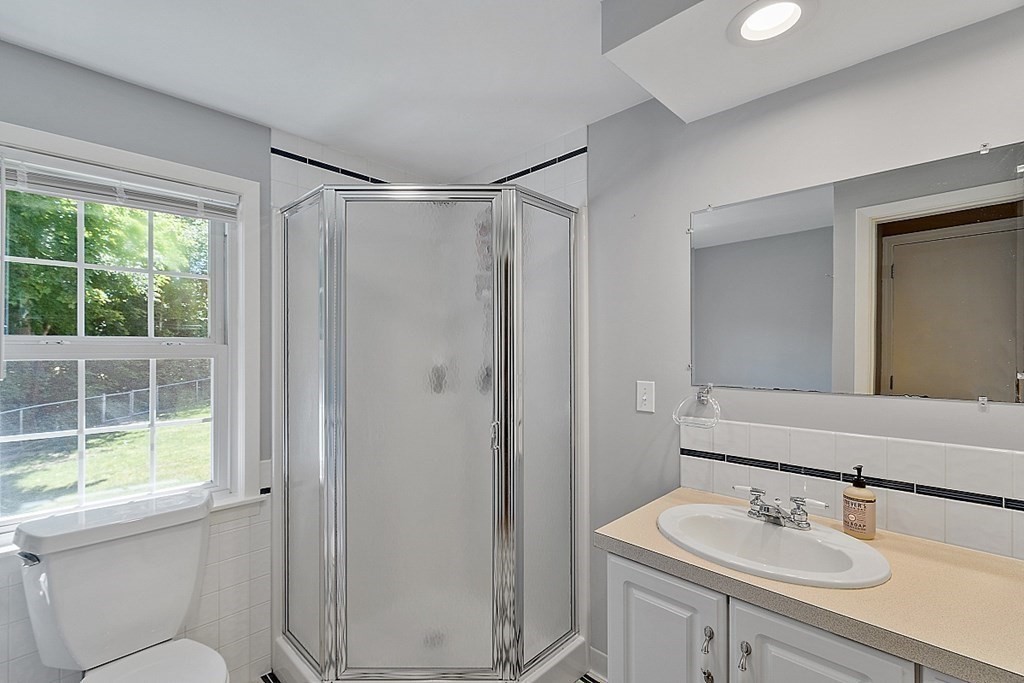43 Sylvan Road Lancaster, MA 01523 - Photo 22 of 26 a bathroom with a sink toilet and shower