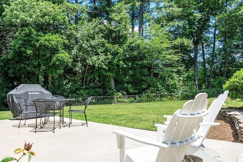 43 Sylvan Road Lancaster, MA 01523 - Photo 23 of 26 a view of a garden with a patio