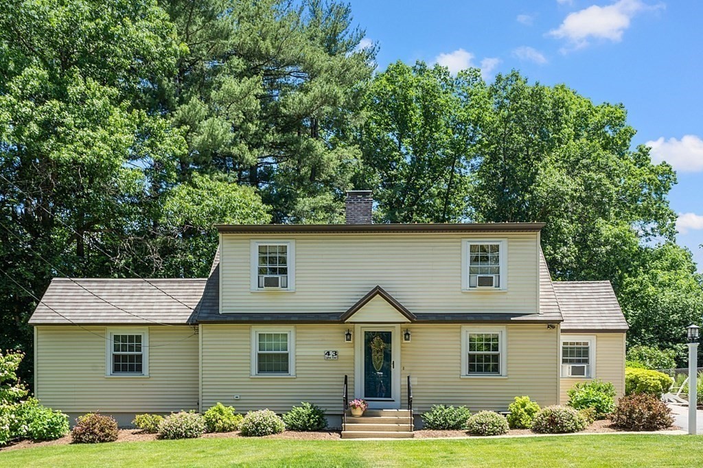 43 Sylvan Road Lancaster, MA 01523 - Photo 26 of 26 a front view of a house with garden