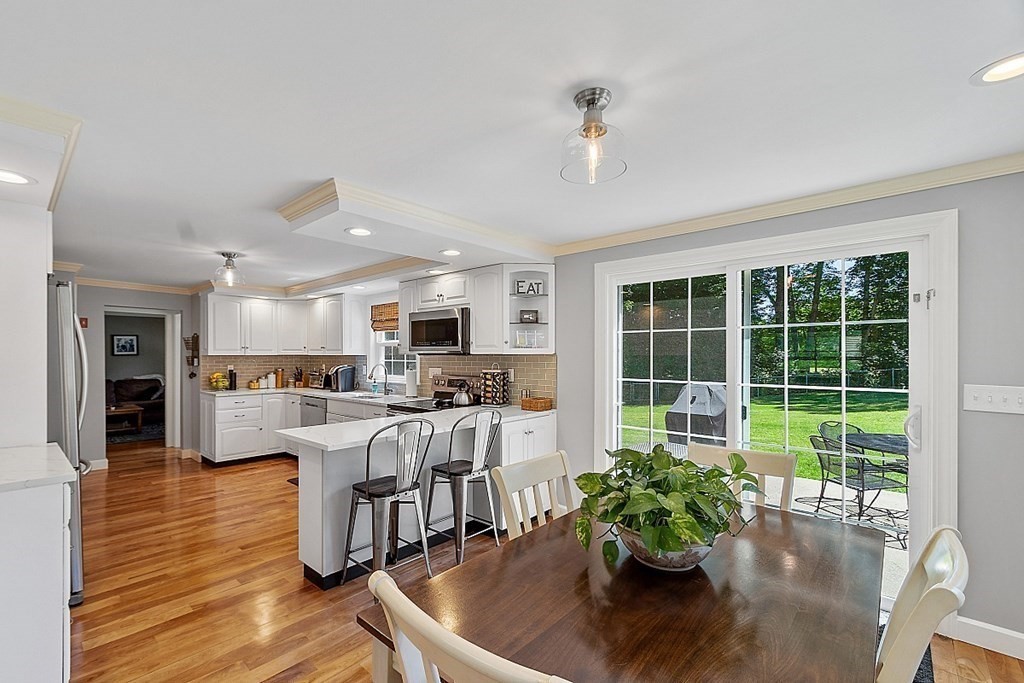 43 Sylvan Road Lancaster, MA 01523 - Photo 6 of 26 a living room with furniture dining table and a large window