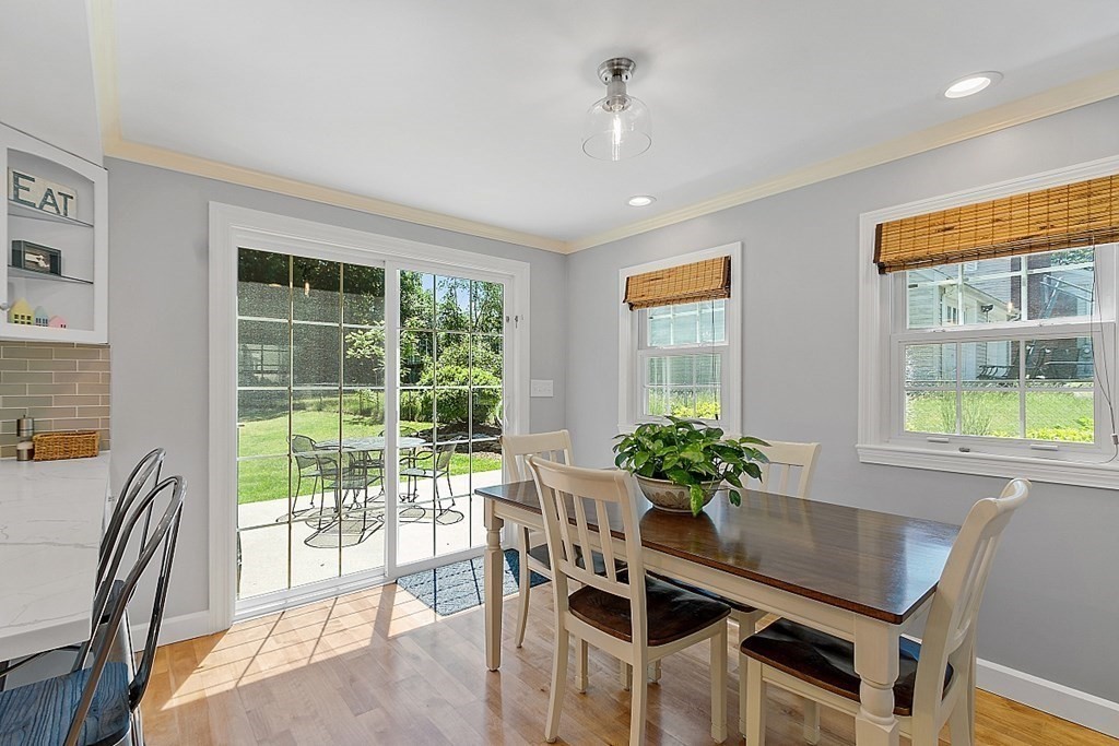 43 Sylvan Road Lancaster, MA 01523 - Photo 7 of 26 a dining room with furniture a chandelier and wooden floor