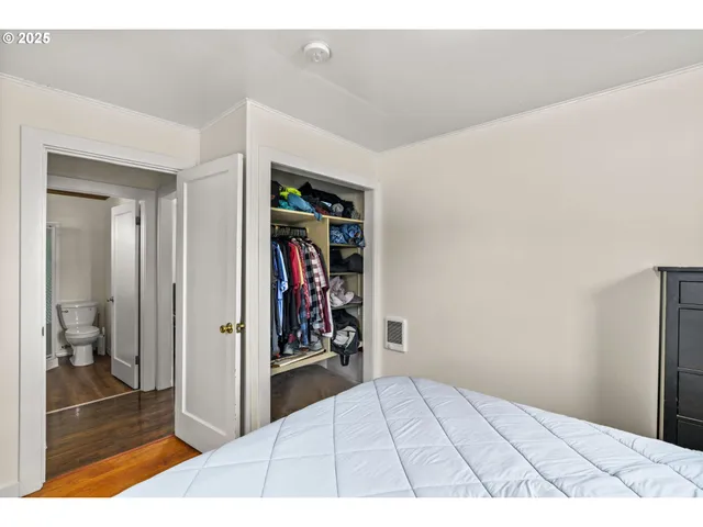a view of a livingroom with bathroom and bathroom