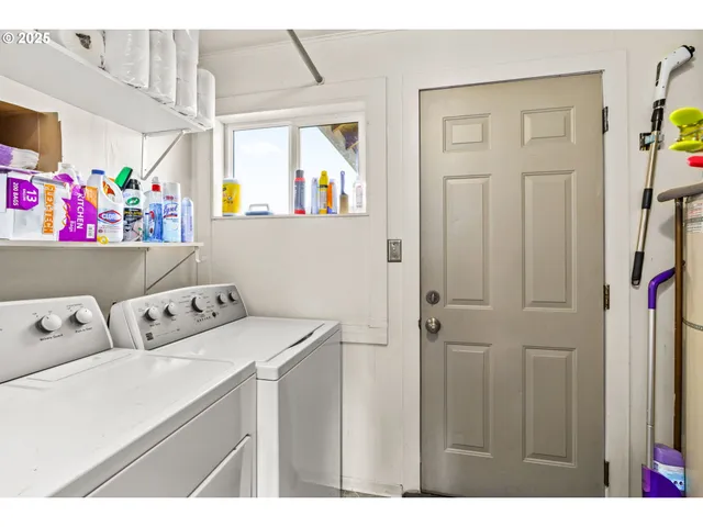 a view of backyard with wooden fence