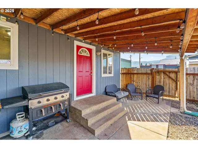 a living room with furniture a rug and a table